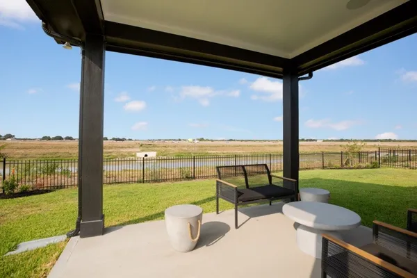 a view of a swimming pool and a patio