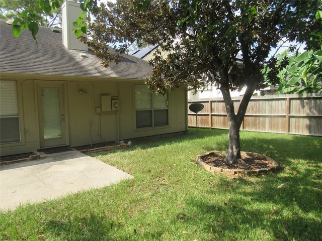 a backyard of a house with lots of green space