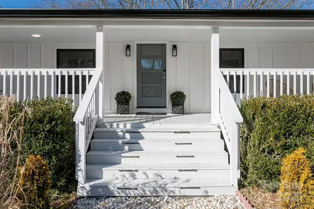 a view of entryway with flower pots