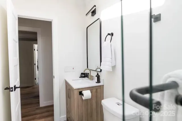 a bathroom with a double vanity sink and mirror
