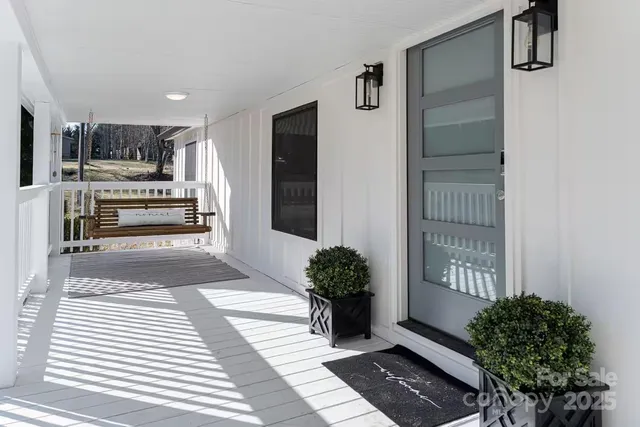 a view of kitchen with sink and refrigerator