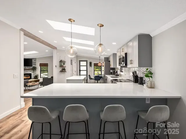 a dining table with chairs and couches