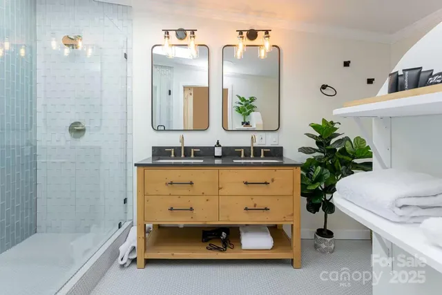 a bathroom with a sink double vanity and a mirror