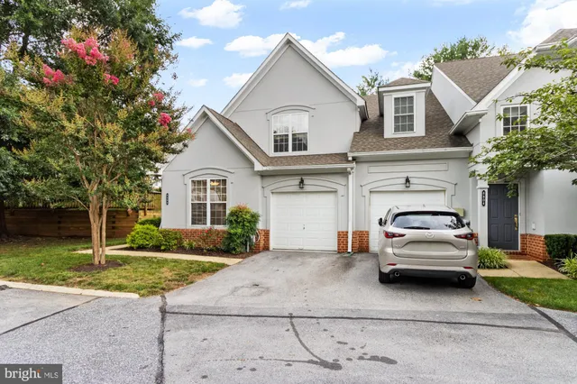 a view of a car parked in front of a house