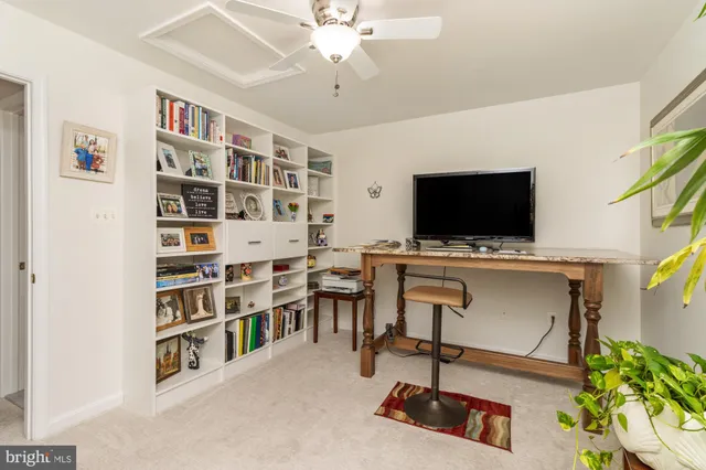 a view of a livingroom with furniture and a flat screen tv