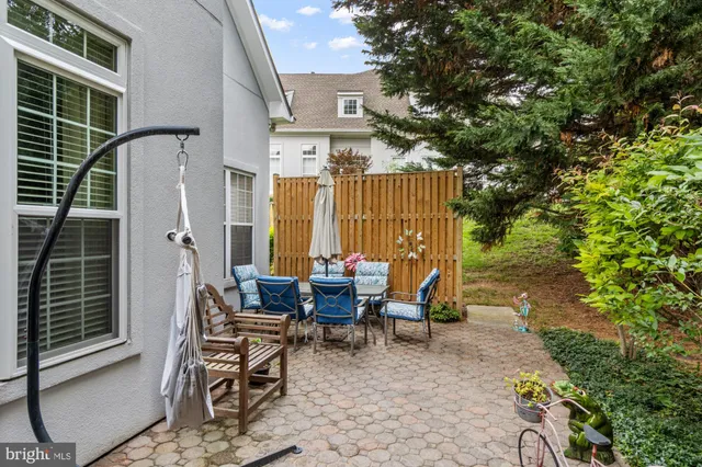 a view of backyard with patio