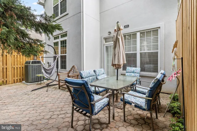a view of a patio with a table and chairs