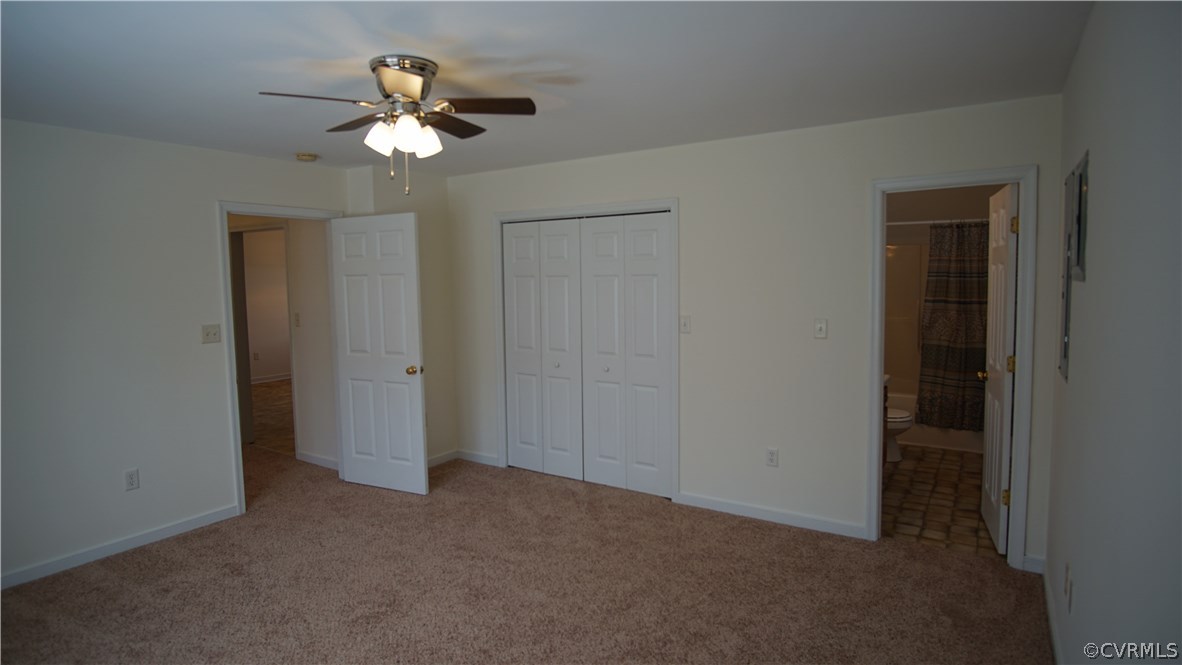 10734 Scotts Road Dewitt, VA 23840 - Photo 21 of 34 a view of an empty room with a chandelier fan