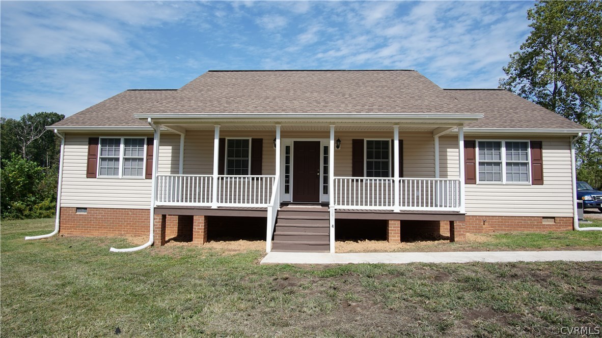 10734 Scotts Road Dewitt, VA 23840 - Photo 3 of 34 a front view of a house with a garden