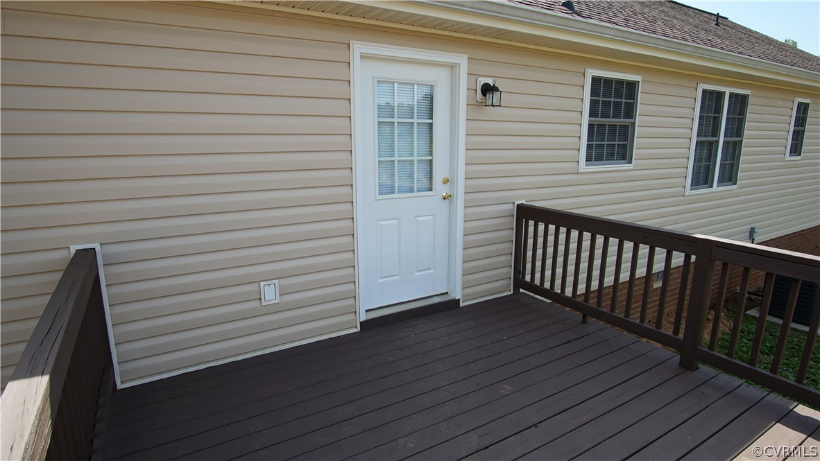 10734 Scotts Road Dewitt, VA 23840 - Photo 10 of 34 a view of a balcony with wooden floor