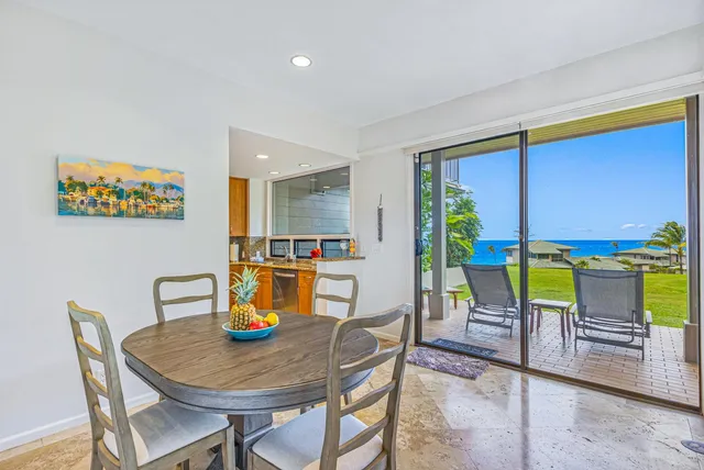 a view of a dining room with furniture window and outside view