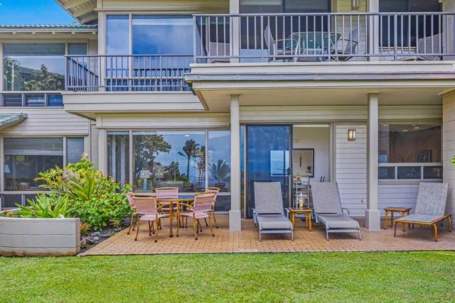 a view of a house with a yard porch and sitting area