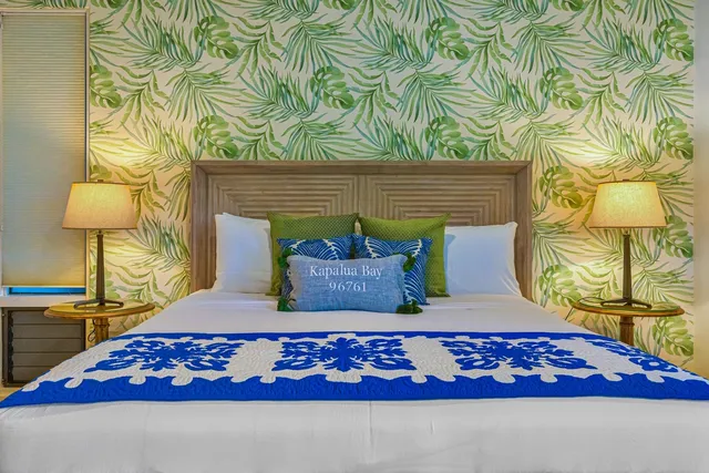 a bed room with a bed and a chair