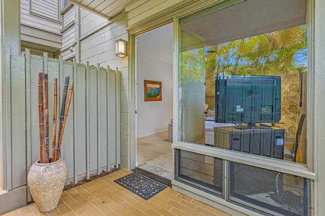 a view of outdoor living space with furniture and garden view