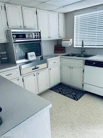 a kitchen with a sink and cabinets