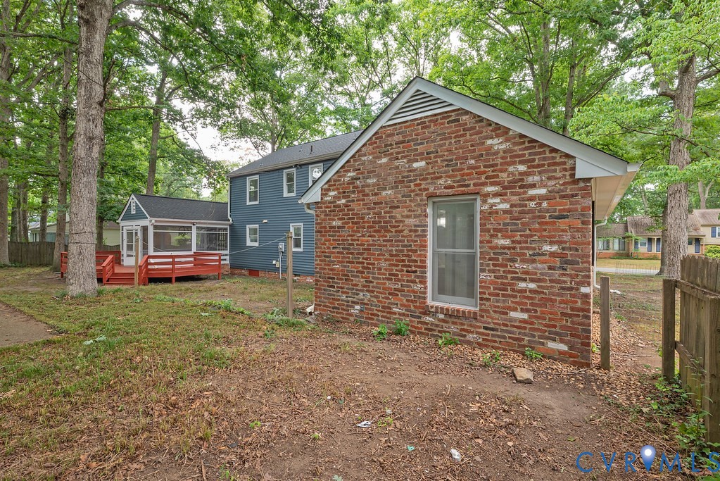 11840 Winfore Drive Midlothian, VA 23113 - Photo 38 of 40 Expansive backyard featuring a red-stained deck, s