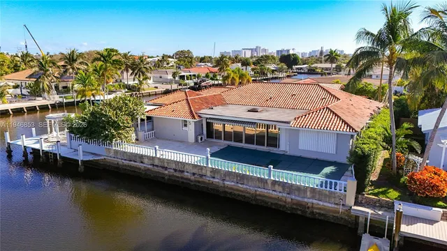 an aerial view of a house with a lake view