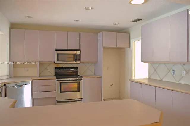 a view of empty room with windows