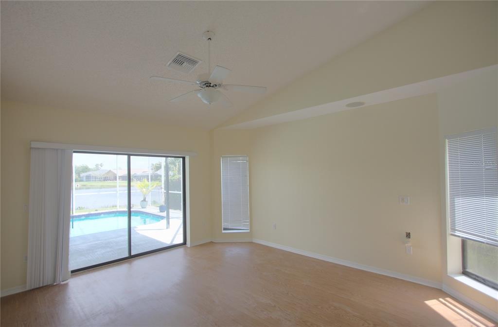 6907 Ranch Road Sarasota, FL 34243 - Photo 4 of 14 an empty room with windows