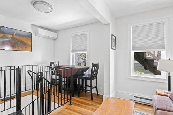 259 Silver Street, Unit 1 Boston, MA 02127 - Photo 3 of 7 a view of a dining room with furniture window and wooden floor
