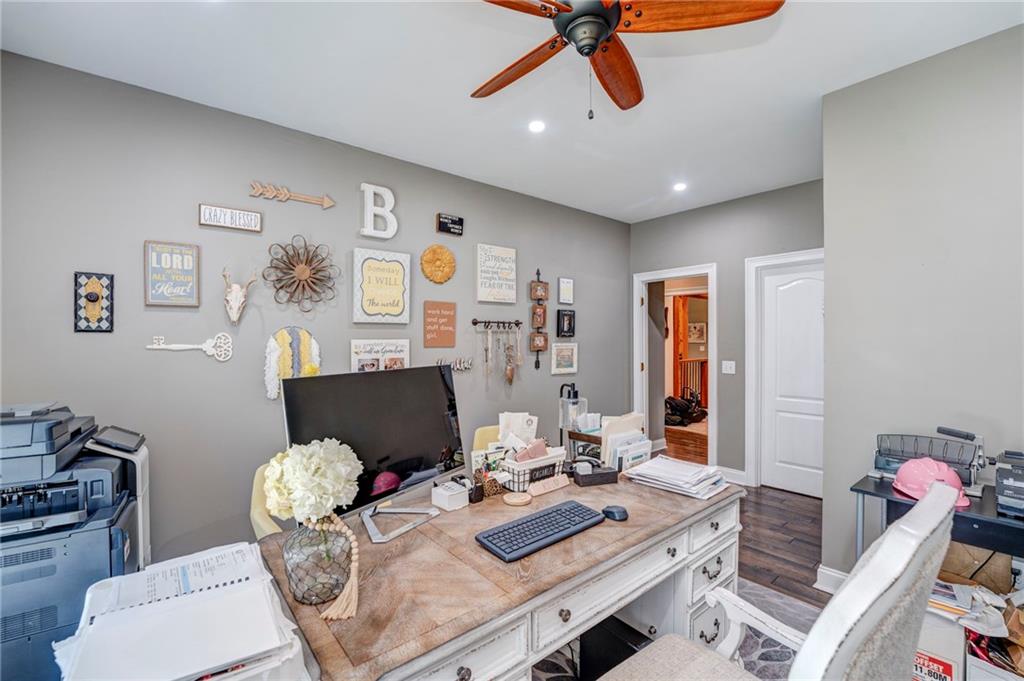 416 Spring Place Road Northeast White, GA 30184 - Photo 29 of 66 a view of a dining room with furniture and wooden floor