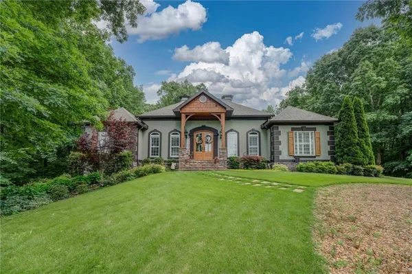 a front view of a house with garden