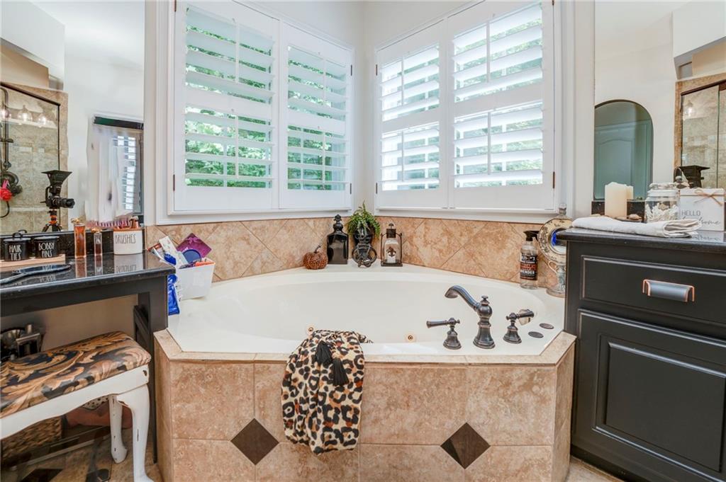 416 Spring Place Road Northeast White, GA 30184 - Photo 40 of 66 a bath tub sitting in a bathroom next to a window