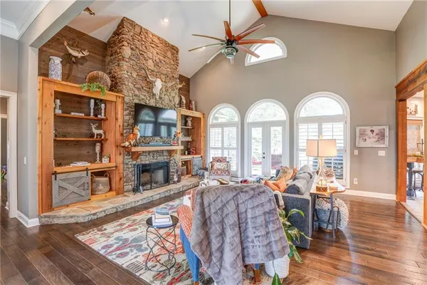 a living room with a fireplace and a fireplace
