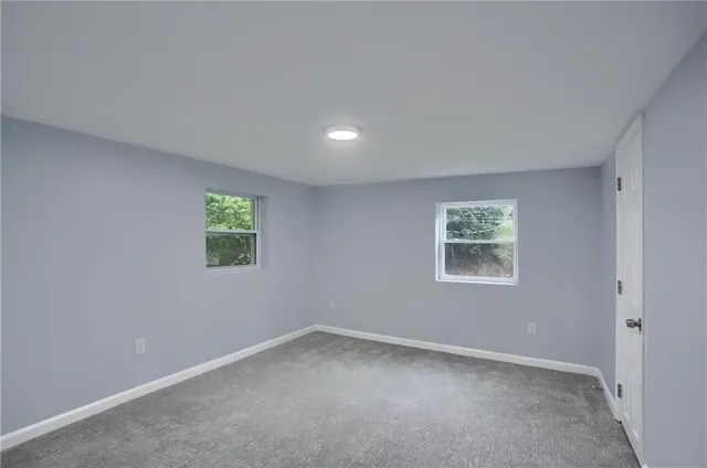 an empty room with windows