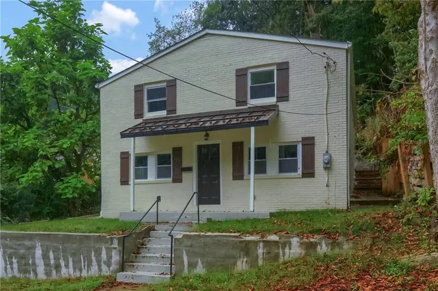 front view of a house with a yard
