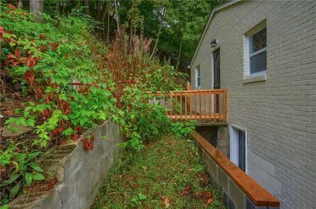 a partial view of a house with a yard