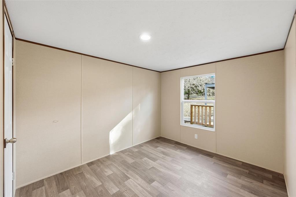 279 Carlisle Court Springtown, TX 76082 - Photo 12 of 18 a view of an empty room with a window