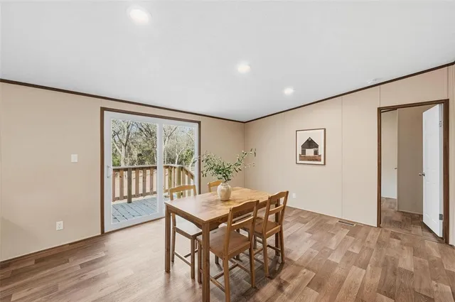 a view of a livingroom with furniture and wooden floor