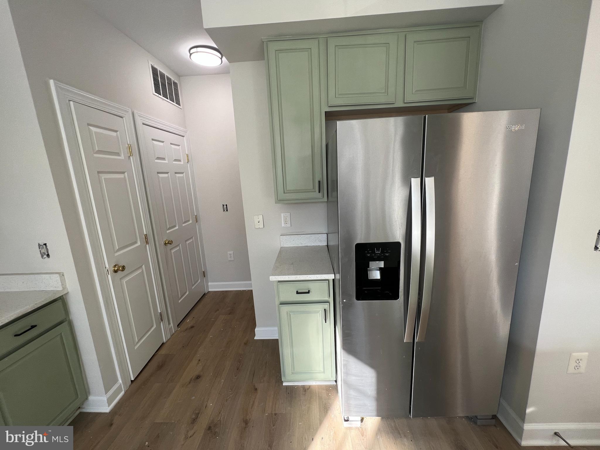 13548 Davinci Lane, Unit 46 Herndon, VA 20171 - Photo 13 of 28 a kitchen with stainless steel appliances a refrigerator and cabinets