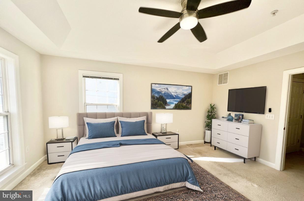 13548 Davinci Lane, Unit 46 Herndon, VA 20171 - Photo 15 of 28 a bedroom with a bed and a flat screen tv