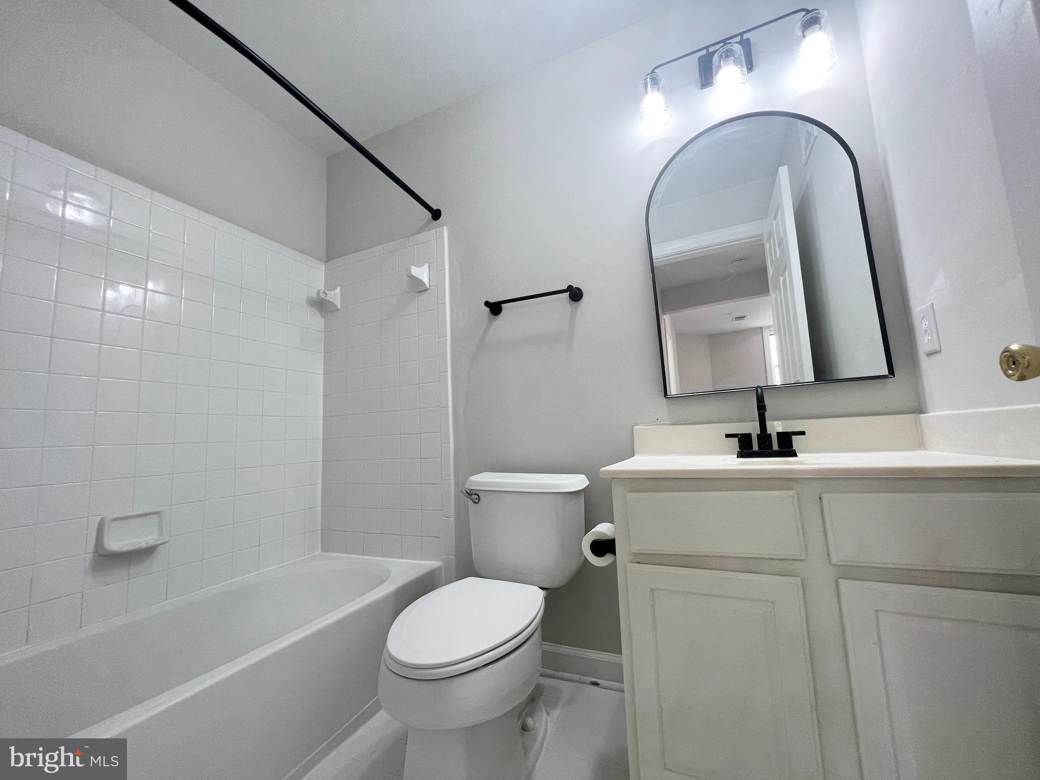 13548 Davinci Lane, Unit 46 Herndon, VA 20171 - Photo 23 of 28 a bathroom with a sink a toilet and shower