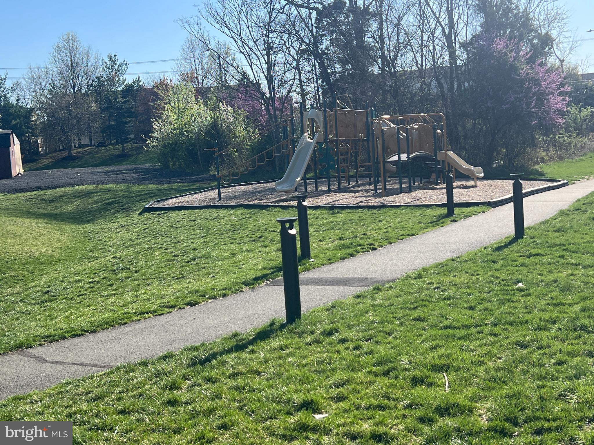 13548 Davinci Lane, Unit 46 Herndon, VA 20171 - Photo 27 of 28 a park view with a bench