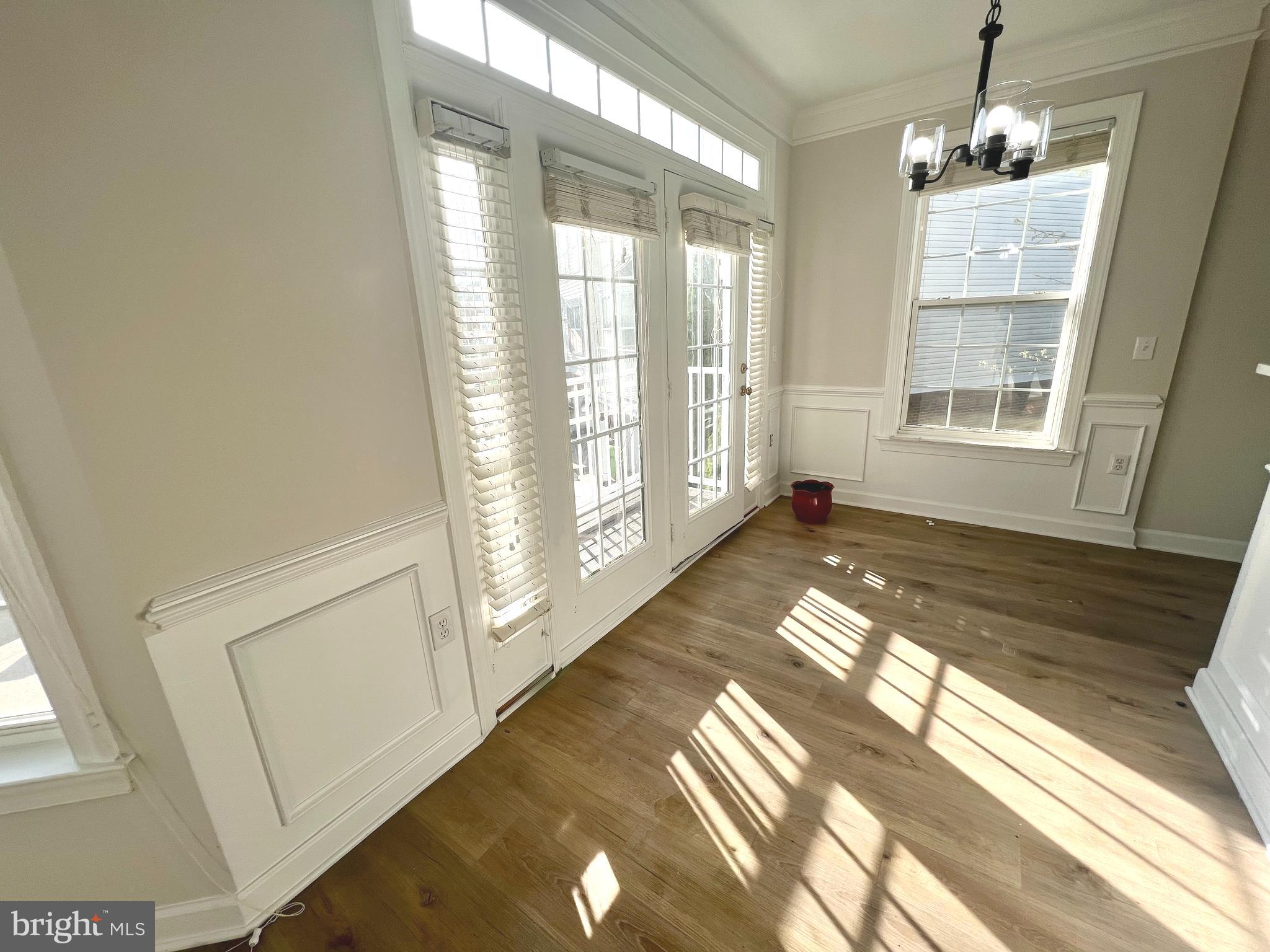 13548 Davinci Lane, Unit 46 Herndon, VA 20171 - Photo 7 of 28 a view of an empty room with wooden floor and a window