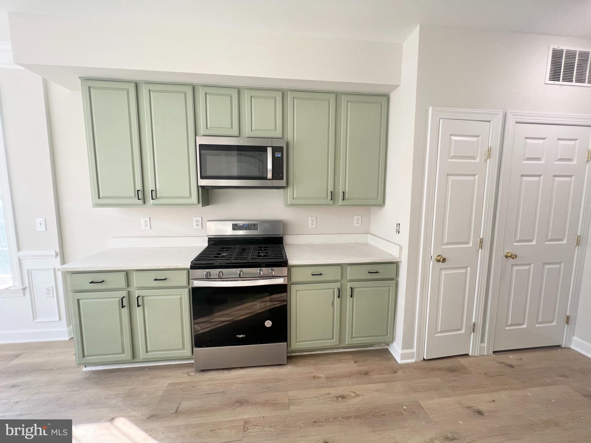 13548 Davinci Lane, Unit 46 Herndon, VA 20171 - Photo 10 of 28 a kitchen with cabinets stainless steel appliances and a sink