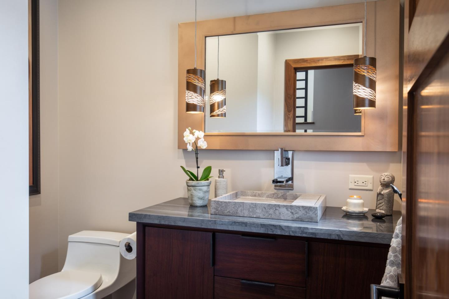 3292 Martin Road Carmel, CA 93923 - Photo 11 of 27 a bathroom with a toilet a sink and mirror