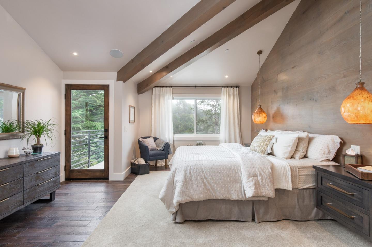 3292 Martin Road Carmel, CA 93923 - Photo 12 of 27 a bedroom with a large bed and windows