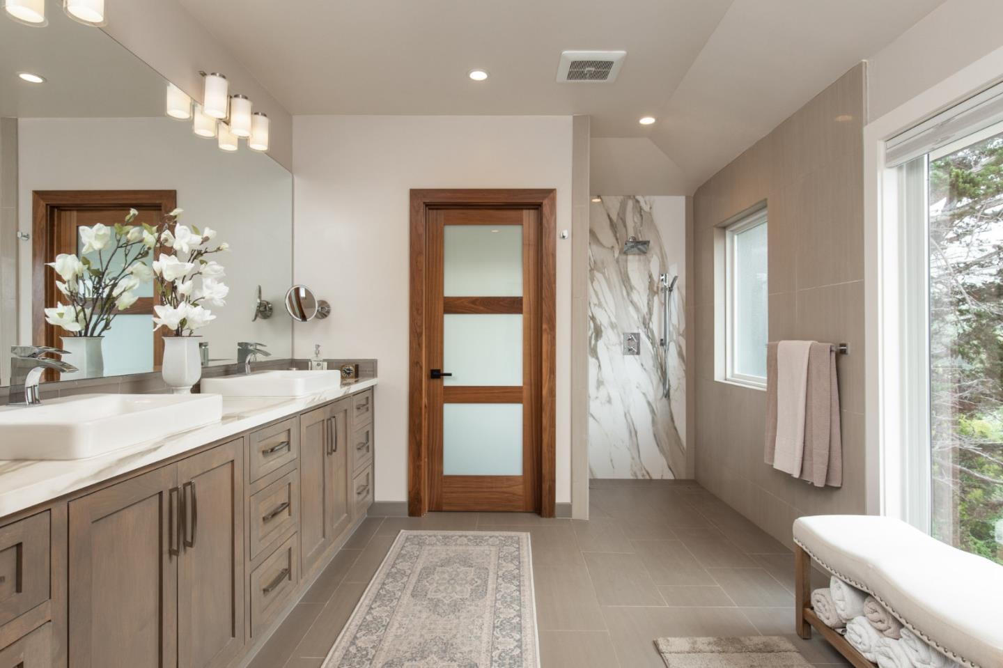 3292 Martin Road Carmel, CA 93923 - Photo 14 of 27 a bathroom with a double vanity sink and a mirror