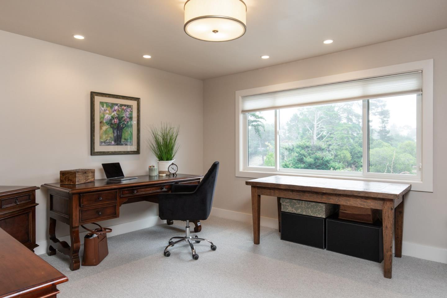 3292 Martin Road Carmel, CA 93923 - Photo 16 of 27 a view of a workspace with furniture and a window