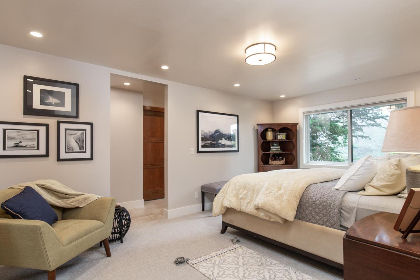 3292 Martin Road Carmel, CA 93923 - Photo 20 of 27 a bedroom with a bed and a couch