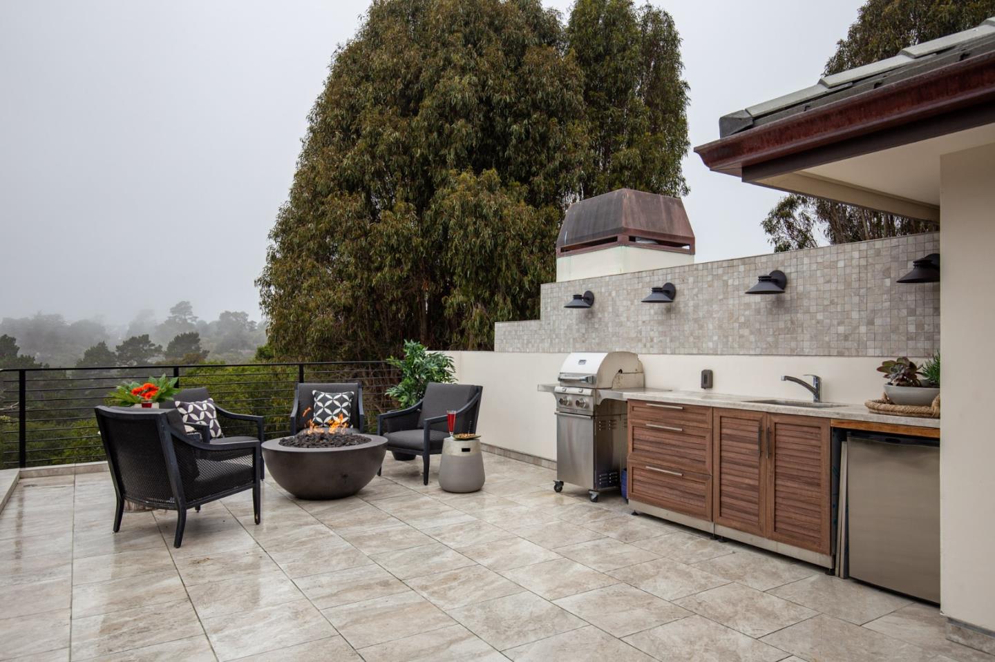 3292 Martin Road Carmel, CA 93923 - Photo 22 of 27 a view of a patio with table and chairs