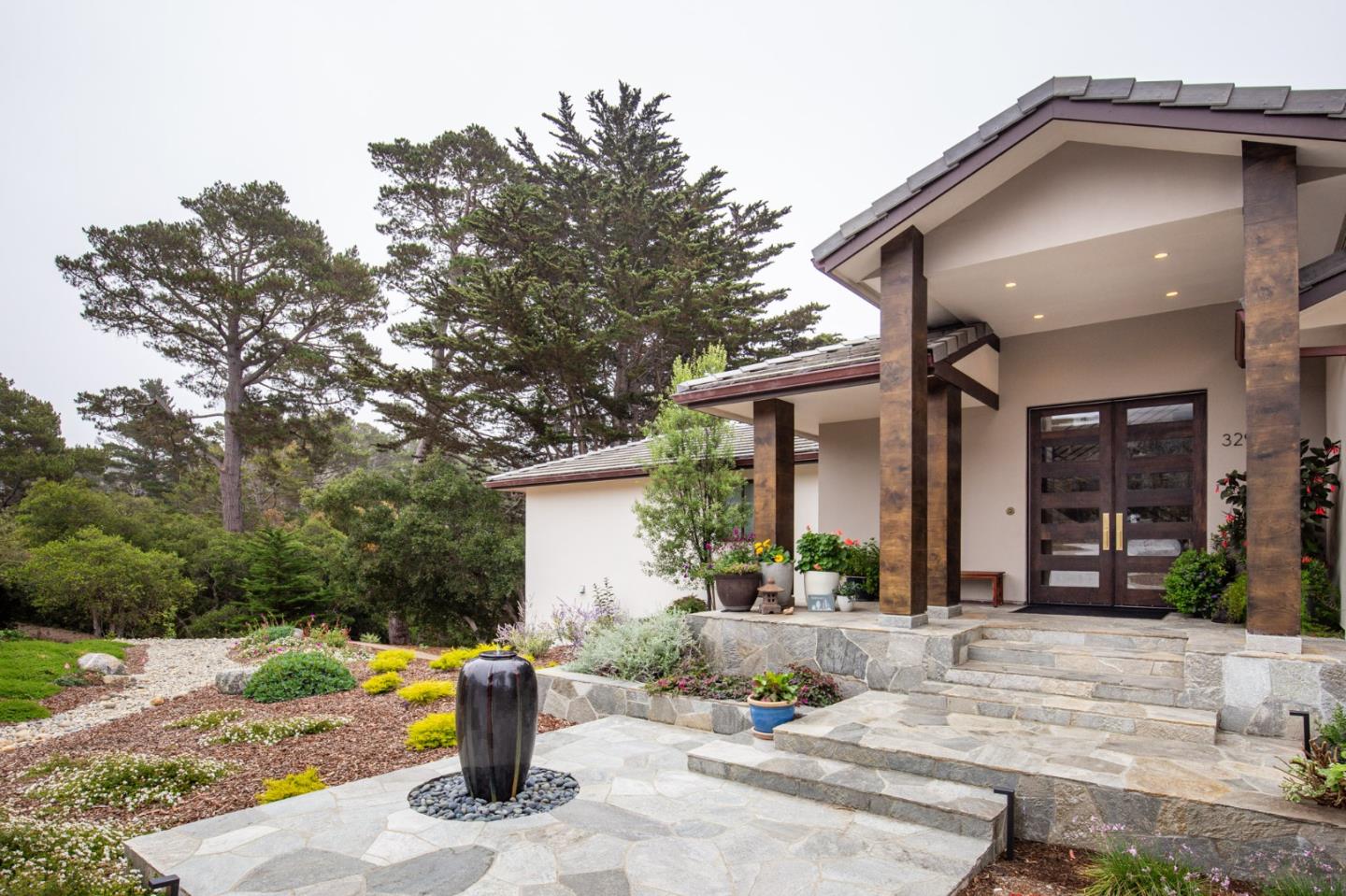 3292 Martin Road Carmel, CA 93923 - Photo 4 of 27 a view of a house with backyard and sitting area