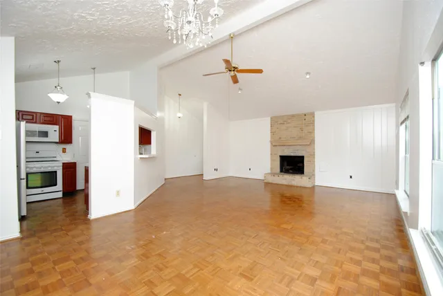 a view of an empty room with a fireplace