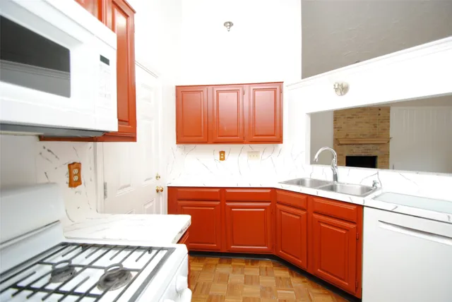 a kitchen with a sink and cabinets