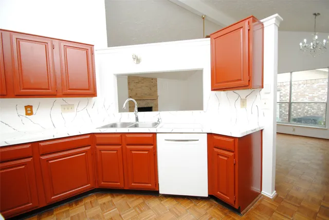 a kitchen with stainless steel appliances granite countertop a sink and cabinets