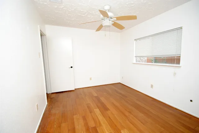a view of a big room with wooden floor
